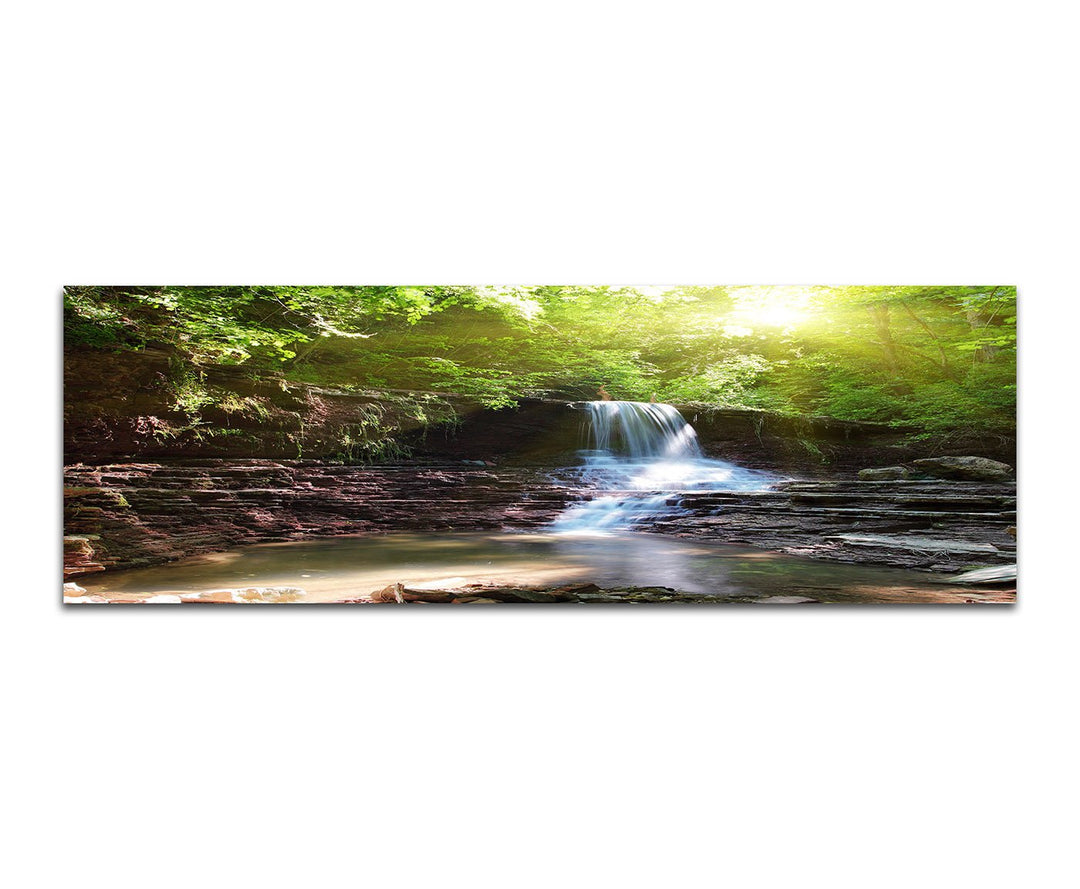 Paul Sinus Art Panoramabild auf Leinwand und Keilrahmen 150x50cm Wald Bäume Wasserfall Bach Sonnenli