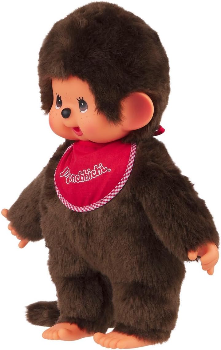 Sekiguchi 255410 - Original Monchhichi Junge, Plüschtier mit rotem Lätzchen und Zöpfen mit Schleifen
