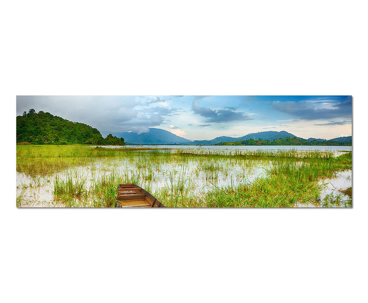 Paul Sinus Art Panoramabild auf Leinwand und Keilrahmen 150x50cm See Gras Boot Berge Landschaft Dämm