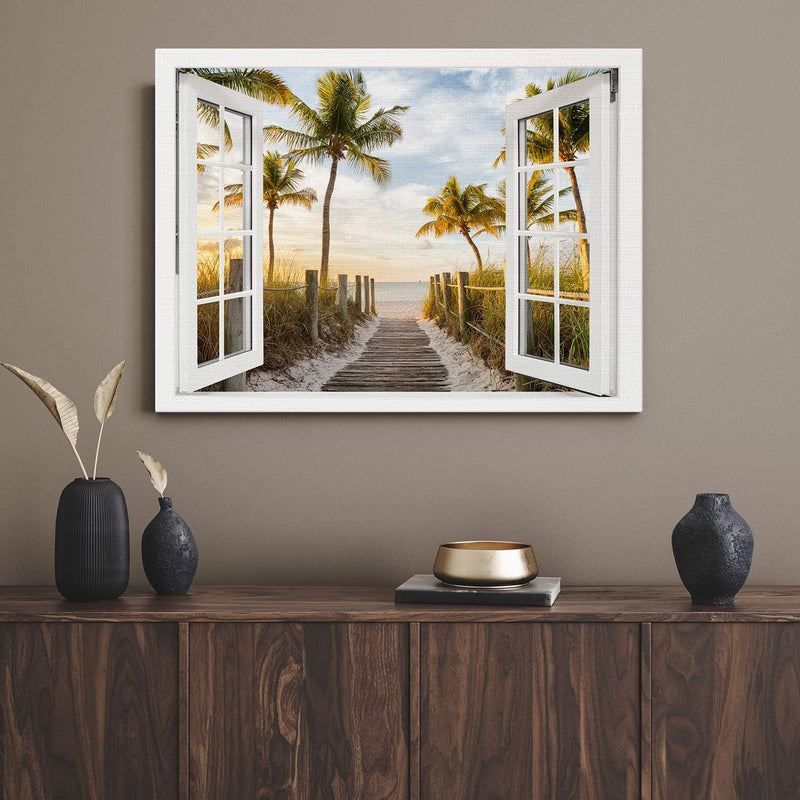 PICANOVA – Bild auf Leinwand Palmenweg zum Meer Fenster 80x60cm – Leinwandbild – Premium Leinwanddru