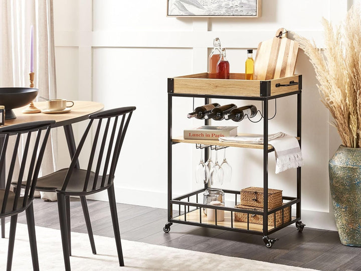 Beliani Servierwagen Heller Holzfarbton Metall schwarz mit Weinregal Glashalter Hullet