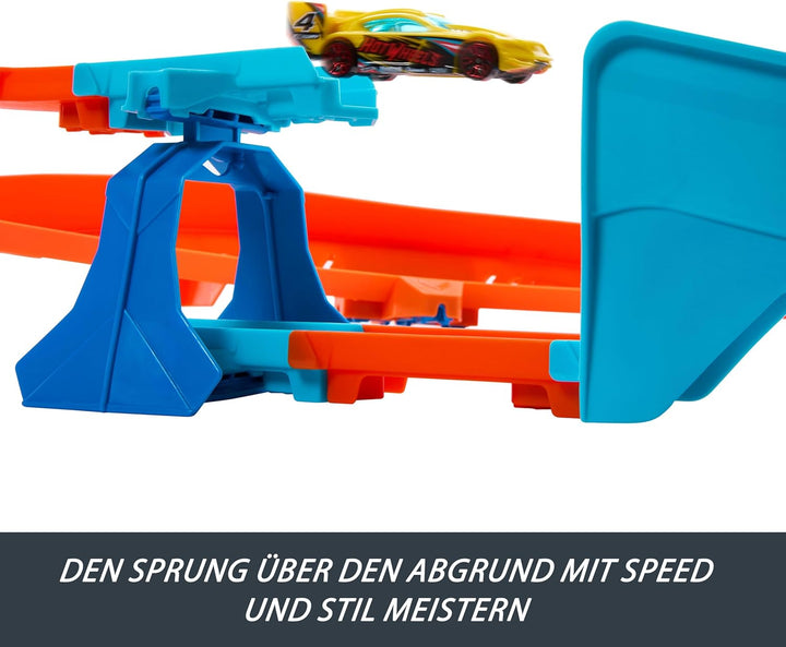 Hot Wheels Spielzeugauto Streckenset, Deluxe-Bauset mit motorisiertem Beschleuniger, Fahrzeug im Mas