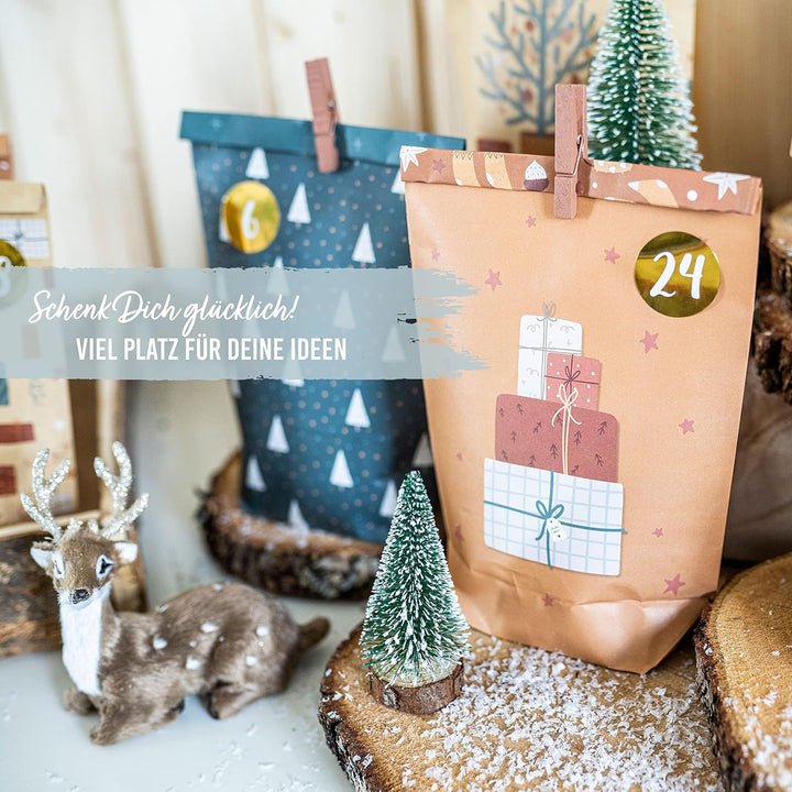 Papierdrachen Adventskalender 2025 zum Befüllen - 24 braune & petrolfarbene bedruckte Geschenktüten