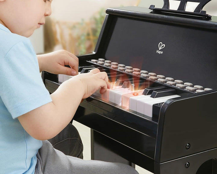Hape Leuchttasten-Piano mit Hocker und Notenhalter, Musikspielzeug aus Holz, ab 3 Jahren, Schwarz