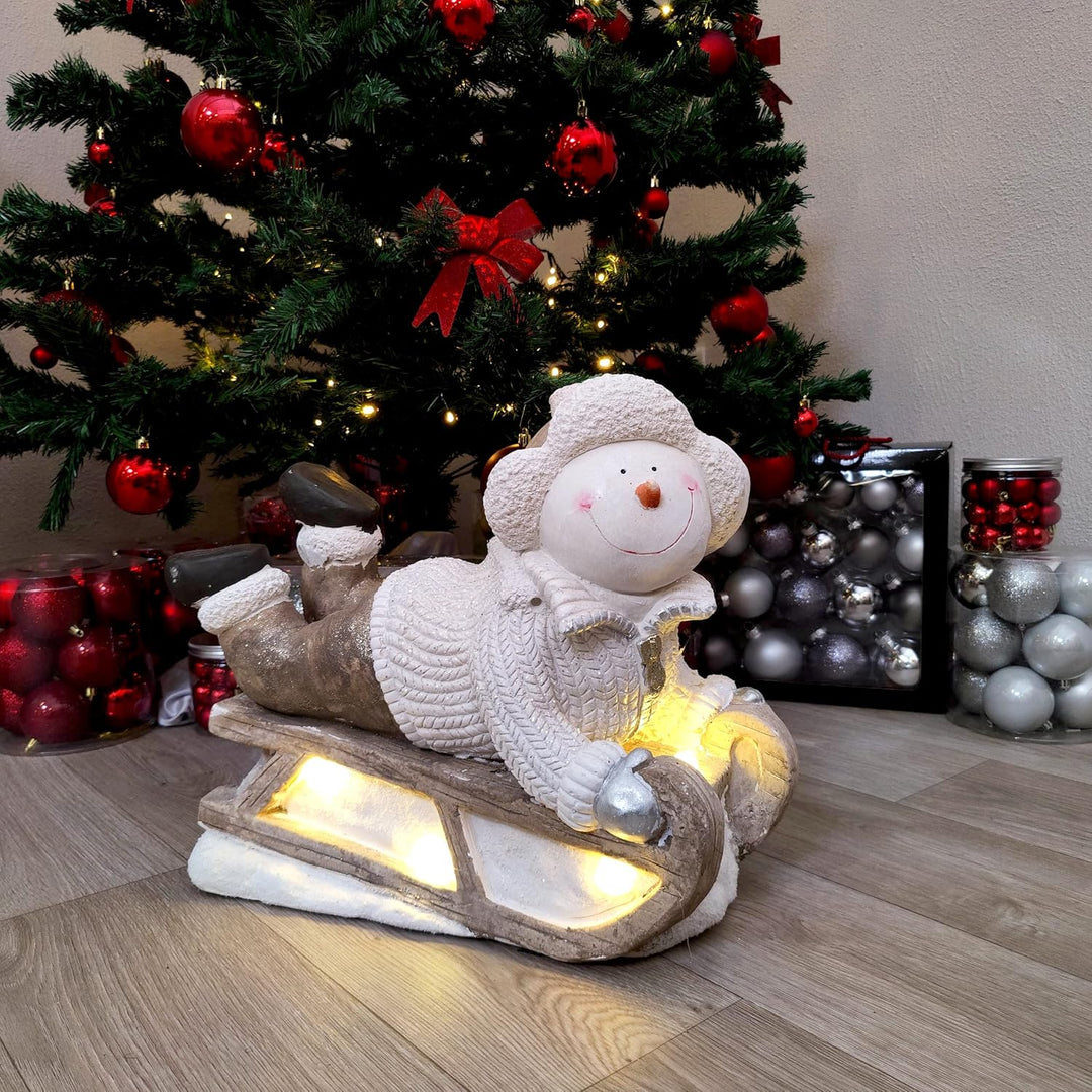 Deko Figur mit Beleuchtung (B) Schneemann auf Schlitten, (B) Schneemann auf Schlitten
