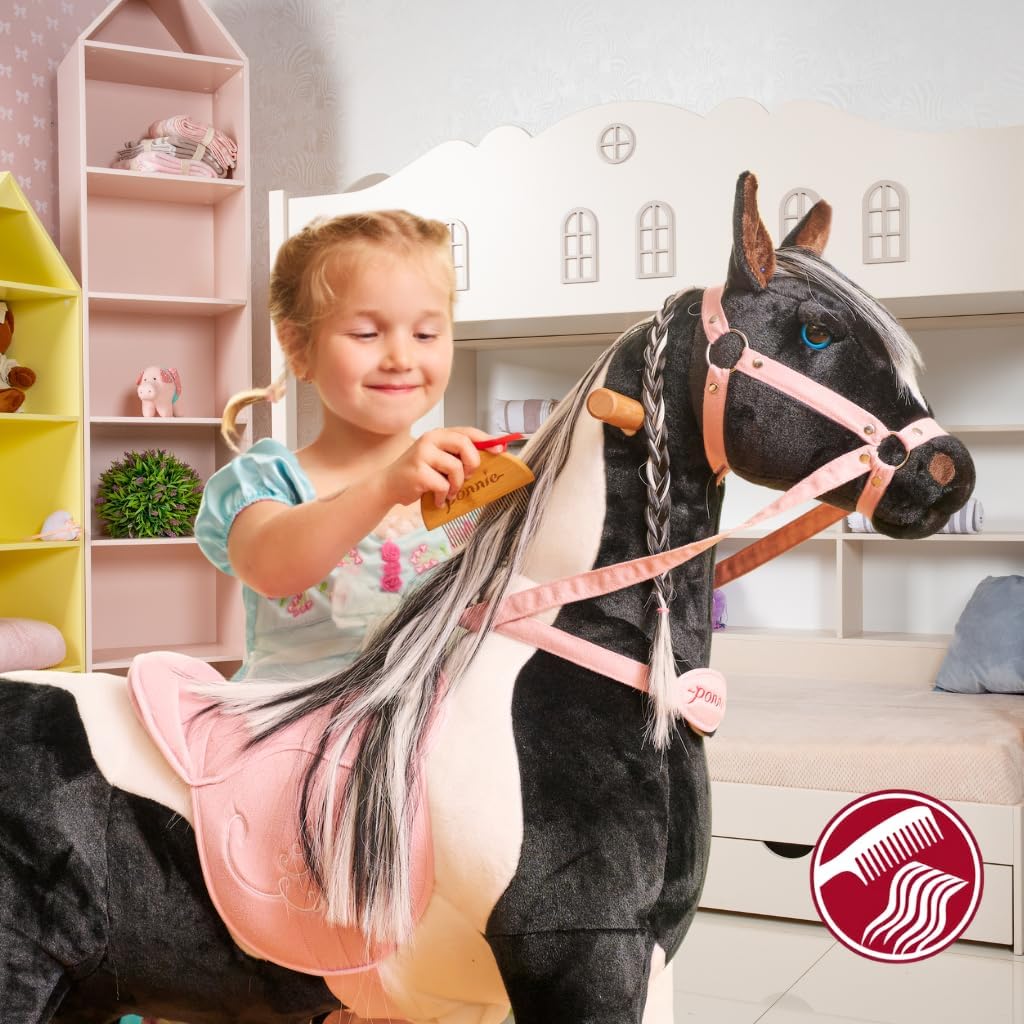 PONNIE Reitpferd mit Rollen Domino M (5-12 Jahre), Spielpferd zum Reiten mit Abnehmbarer Rosa Sattel