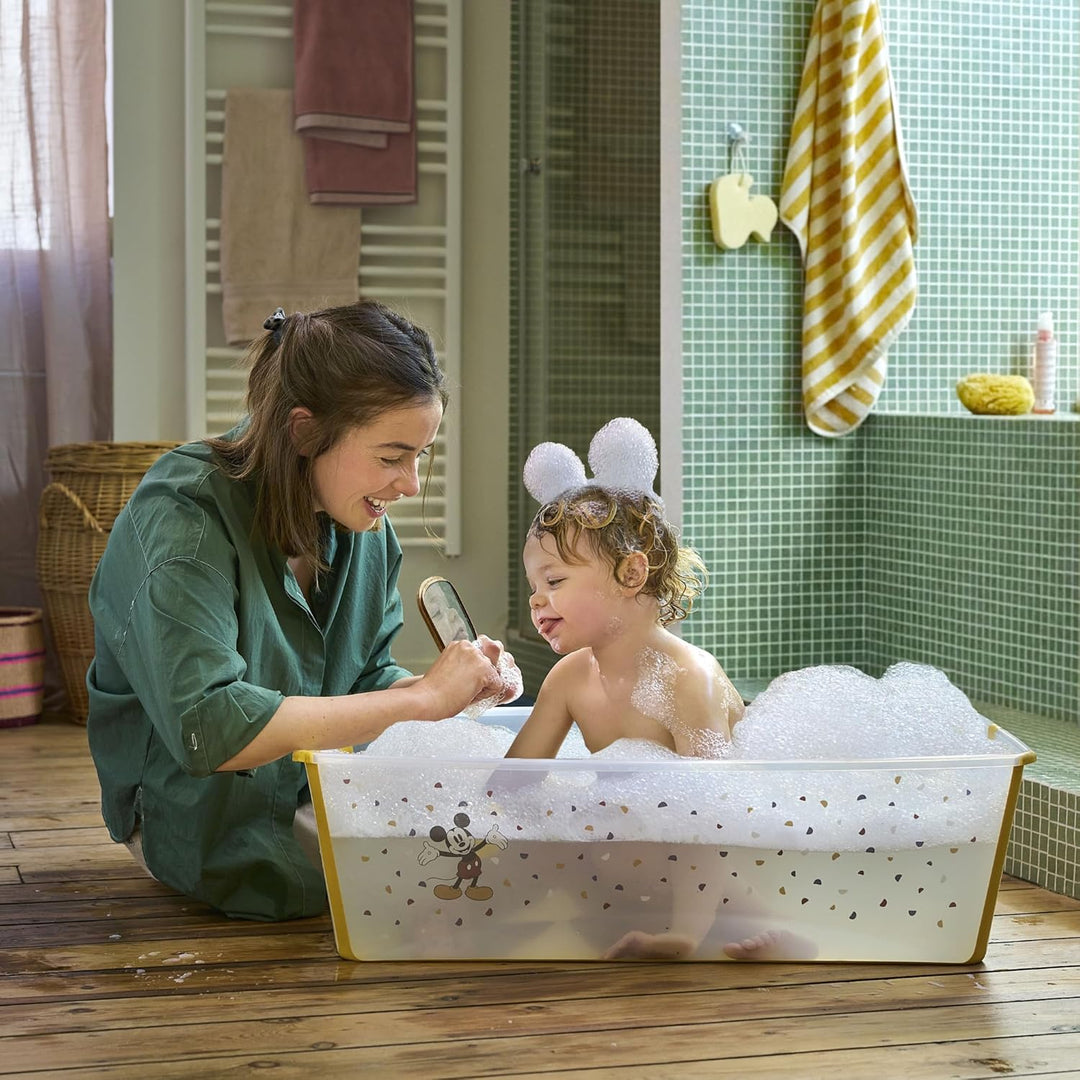 Stokke Flexi Bath, Mickey Celebration - 64 x 24 x 34 cm - Faltbare Babybadewanne für Neugeborene und