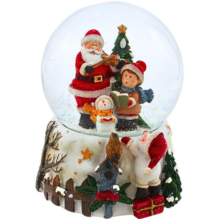 Dekohelden24 Schneekugel - Weihnachtsmann mit Geige und singendem Kind und Schneemann, mit Spielwerk