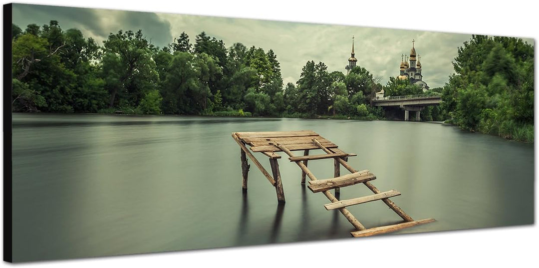 Paul Sinus Art Panoramabild auf Leinwand und Keilrahmen 150x50cm See Holzsteg Bäume Kirche Himmel