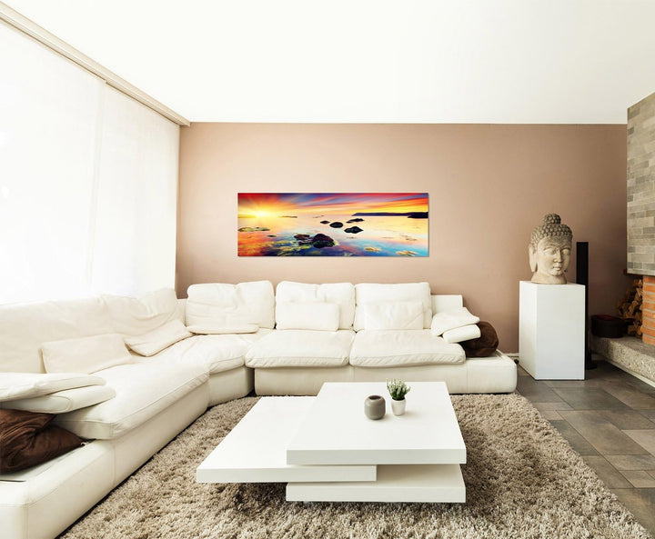 Paul Sinus Art Panoramabild auf Leinwand und Keilrahmen 150x50cm Meer Steine Abendhimmel Sonnenunter