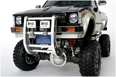 TAMIYA TMYTAM58397 1:10 RC Toyota HiLux HighLift 4x4 3-Gang - ferngesteuertes Auto - inkl. Surfbrett