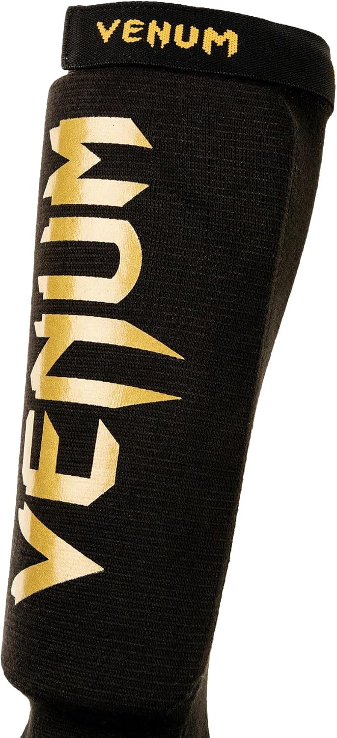 Venum Art: Uni Kontact Schienbein-und Fussschutz M schwarz / gold
