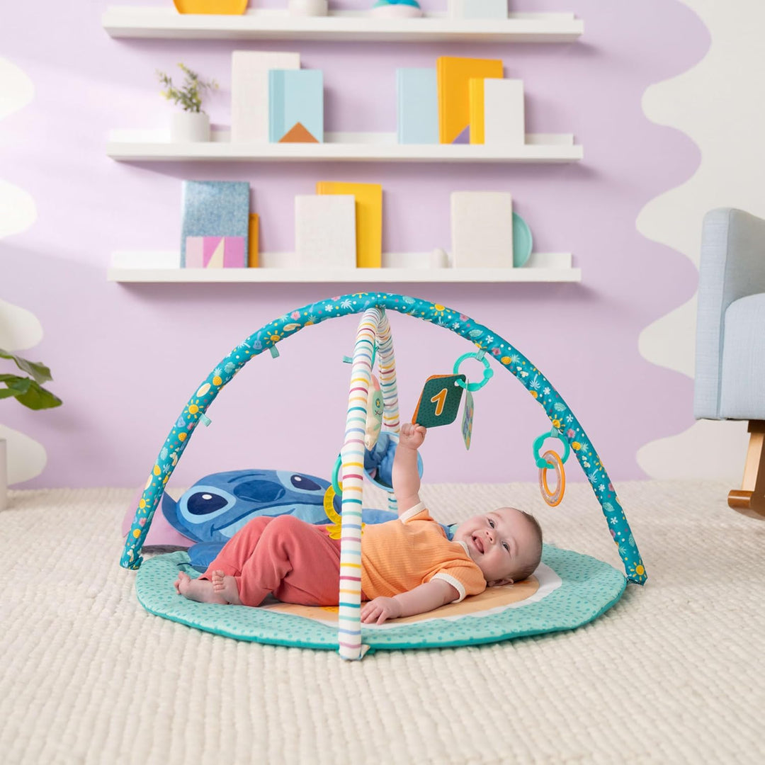Disney Baby Stitch Party im Paradies – Aktivitätsspielzeug von Bright Starts mit Bauchlage-Kissen un