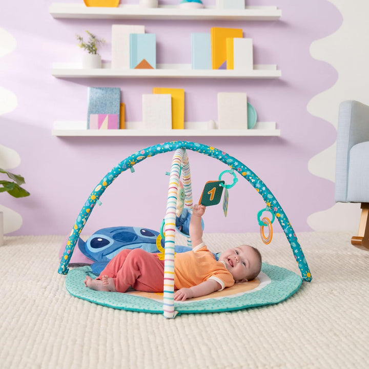 Disney Baby Stitch Party im Paradies – Aktivitätsspielzeug von Bright Starts mit Bauchlage-Kissen un