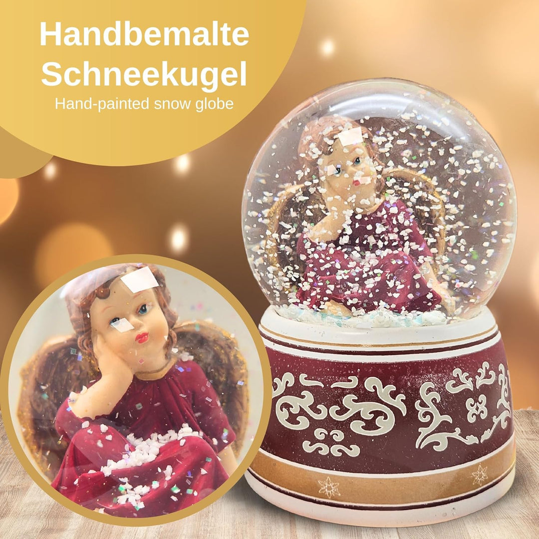 Schneekugel Weihnachten mit Musik | Engel rot verträumt Gold | Sockel rot Gold Ornamente | H: 14cm B