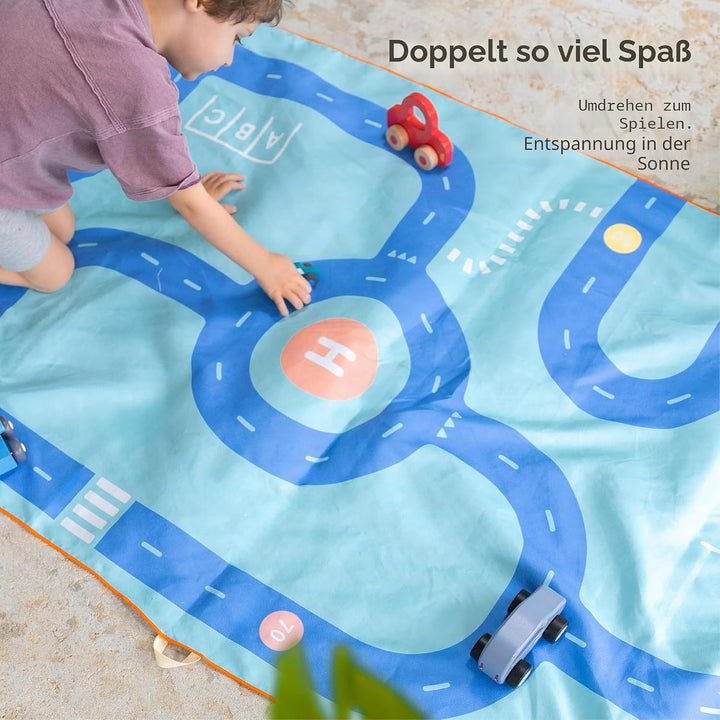 Quut – Strand-/Poolhandtuch für Kinder mit Spiel – Ultraschnell trocknende Mikrofaser, sandfrei – ko