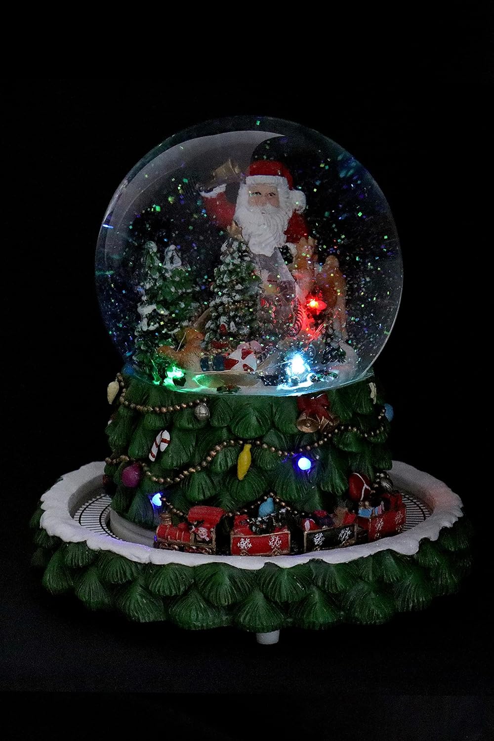 Schneekugel/Spieluhr Tannenbaum ⌀150mm, weihnachtlicher Sockel mit rotierendem Zug, Musik, Licht &amp; S