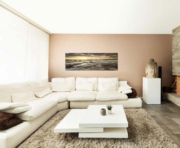 Paul Sinus Art Panoramabild auf Leinwand und Keilrahmen 150x50cm Meer Steine Felsen Wolken Sonnenauf