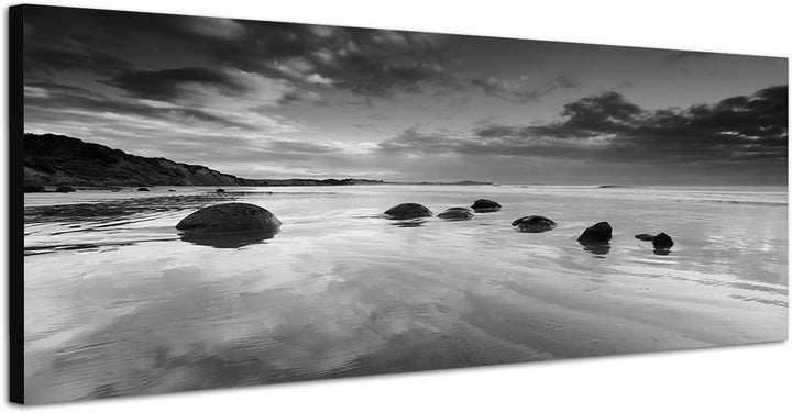 Paul Sinus Art Leinwandfoto als Panorama SCHWARZ/Weiss 120x40cm Neuseeland Meer Strand Steine Morgen