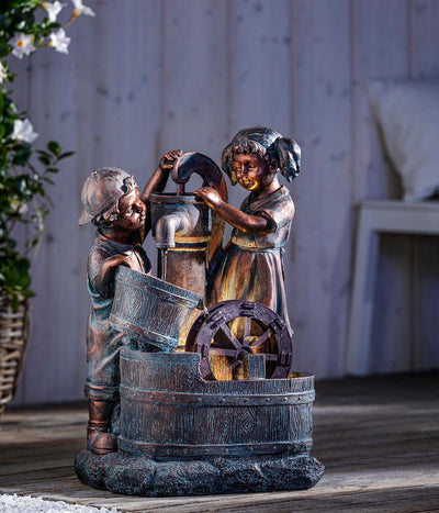 Dehner Gartenbrunnen Lea und Leon mit LED Beleuchtung, ca. 68.5 x 45 x 35 cm, Polyresin, grün/blau/b