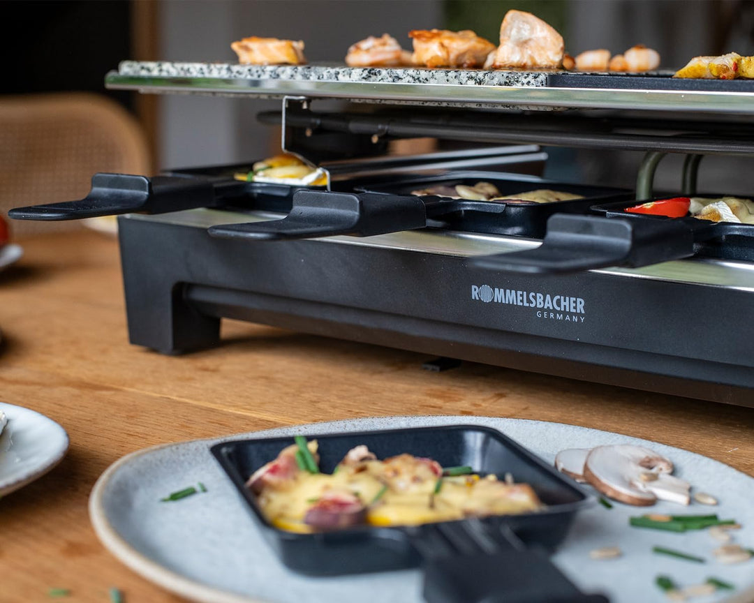 ROMMELSBACHER Raclette Grill RCS 1350 – 2 Wendegrillplatten, 1 Steingrillplatte, 8 Pfännchen, 8 Scha