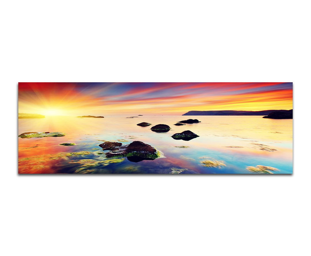 Paul Sinus Art Panoramabild auf Leinwand und Keilrahmen 150x50cm Meer Steine Abendhimmel Sonnenunter