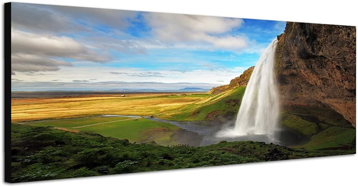 Paul Sinus Art Panoramabild auf Leinwand und Keilrahmen 150x50cm Felsen Wasserfall Wiesen Wolken Him