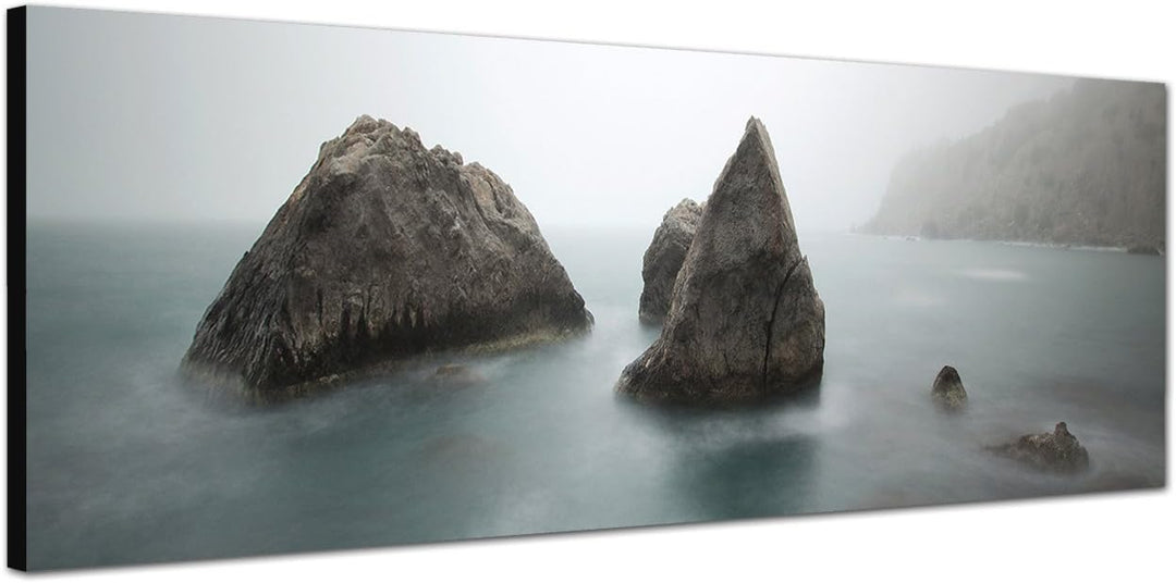 Paul Sinus Art Panoramabild auf Leinwand und Keilrahmen 150x50cm Meer Morgendämmerung Nebel Felsen