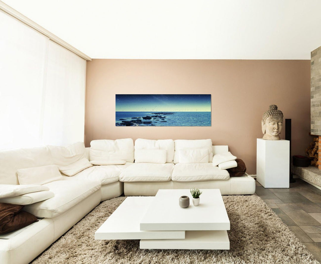 Paul Sinus Art Panoramabild auf Leinwand und Keilrahmen 150x50cm Meer Steine Vögel Morgengrauen Ster