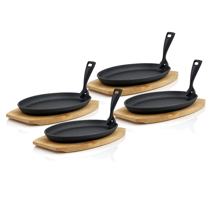 BBQ-Toro Gusseisen Servierpfännchen mit Holzunterlage (4 Stück) | 27 x 18 x 3 cm - oval | bereits ei