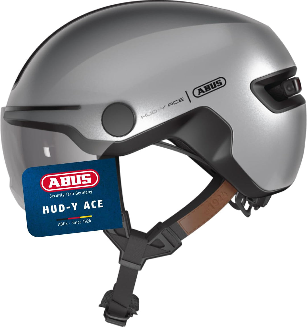 ABUS Stadthelm HUD-Y ACE - stylischer Fahrradhelm mit Visier und magnetischem, aufladbarem LED-Rückl