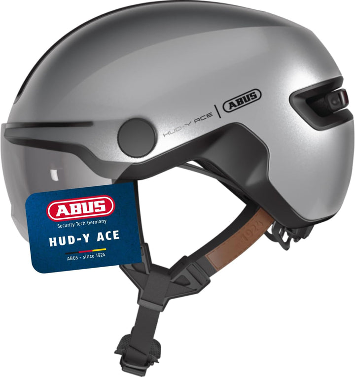 ABUS Stadthelm HUD-Y ACE - stylischer Fahrradhelm mit Visier und magnetischem, aufladbarem LED-Rückl