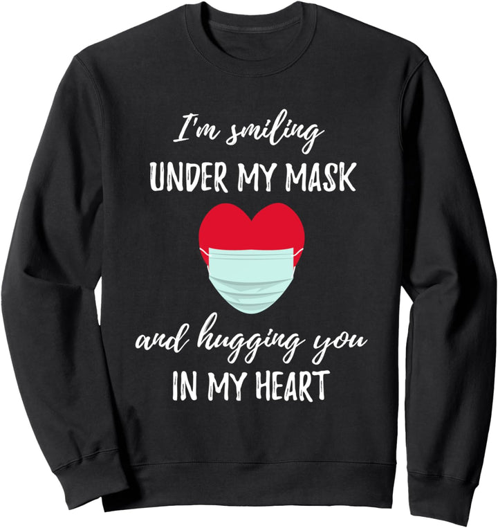 Ich lächle unter meiner Maske und umarme dich in meinem Sweatshirt