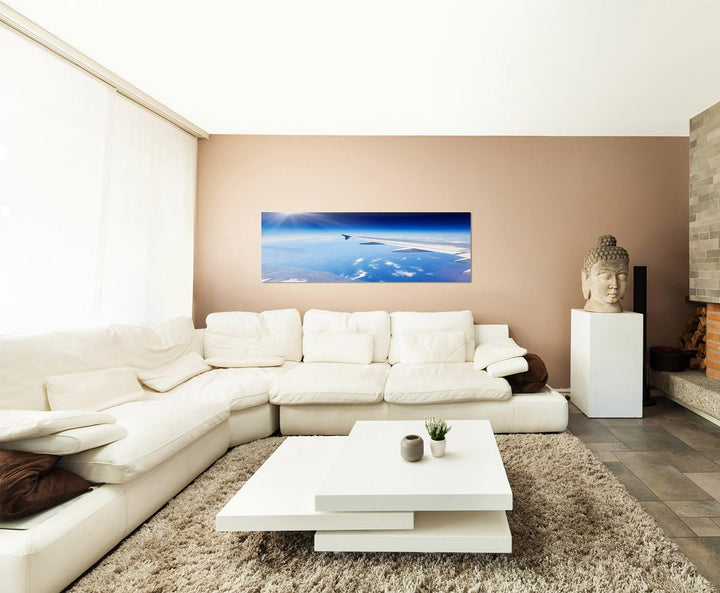Paul Sinus Art Panoramabild auf Leinwand und Keilrahmen 150x50cm Flugzeug Flügel Himmel Wolken