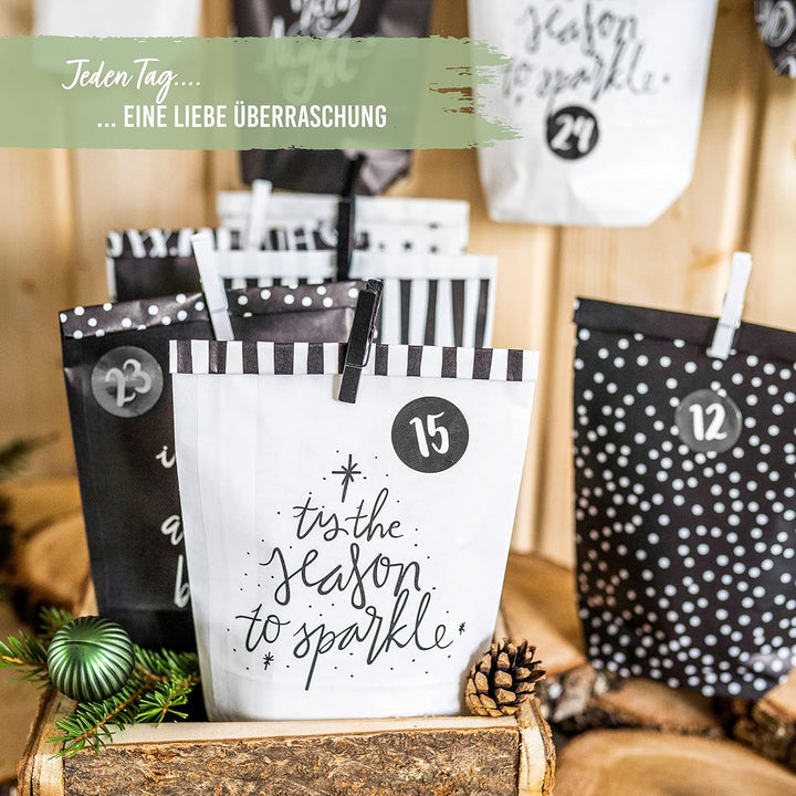 Papierdrachen Adventskalender zum Befüllen - 24 schwarze und weisse bedruckte Geschenktüten und 24 Z