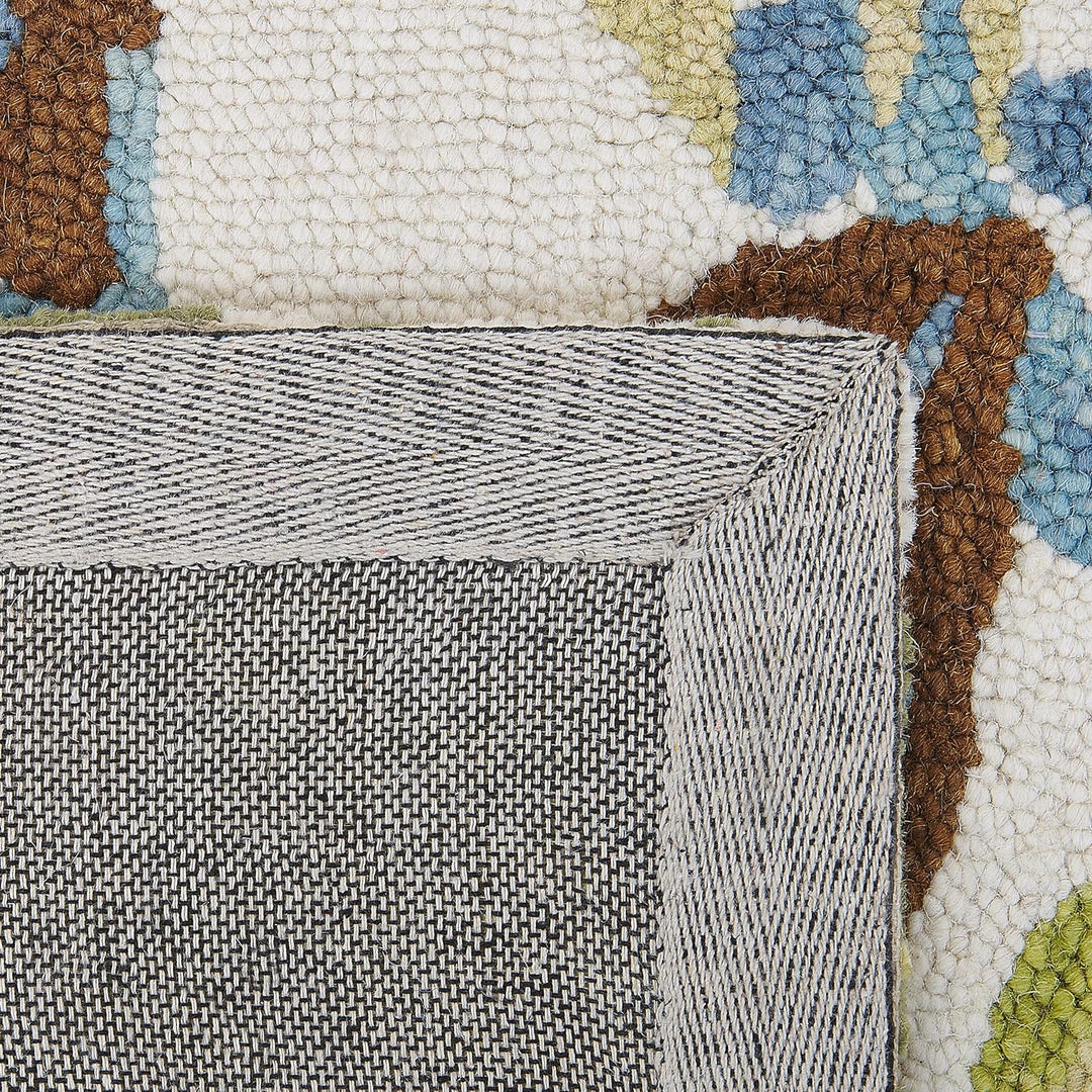 Teppich Wolle bunt Blattmuster 140 x 200 cm handgetuftet Boho Rustikal Kinik