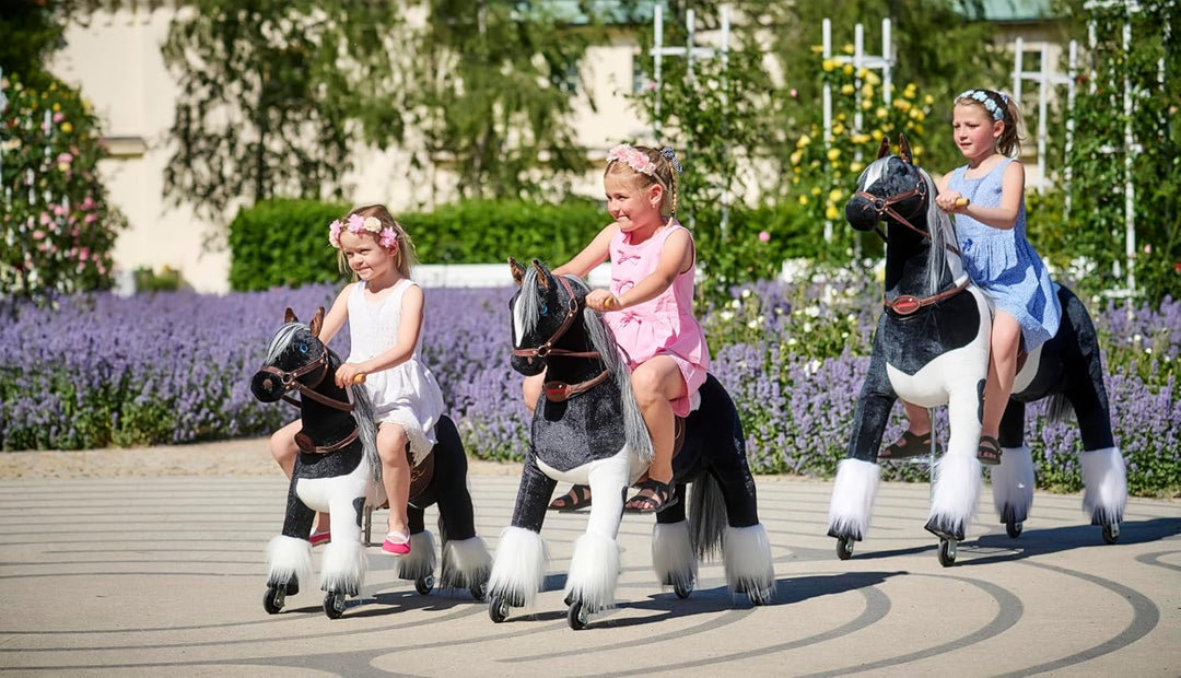 PONNIE Reitpferd mit Rollen Domino S (3-6 Jahre), Spielpferd zum Reiten mit Abnehmbarer Rosa Sattel