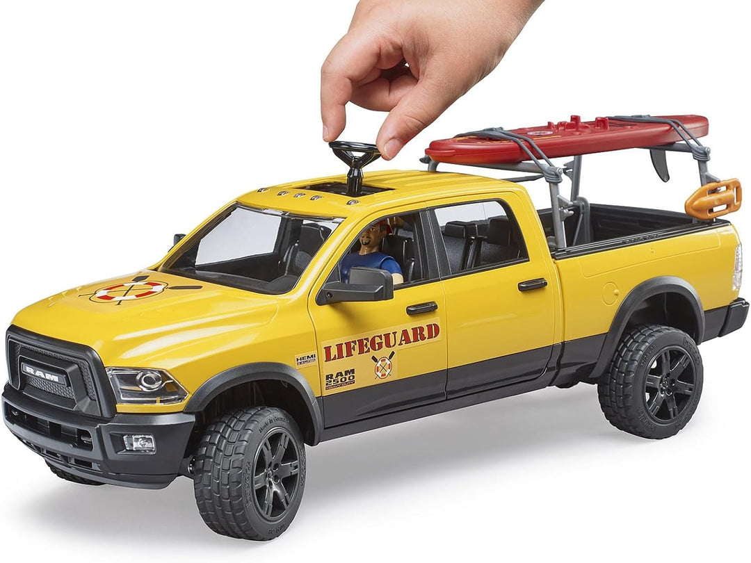 bruder 02506 - RAM 2500 Power Wagon Life Guard mit Figur, Stand-Up Paddle & Light and Sound Modul -