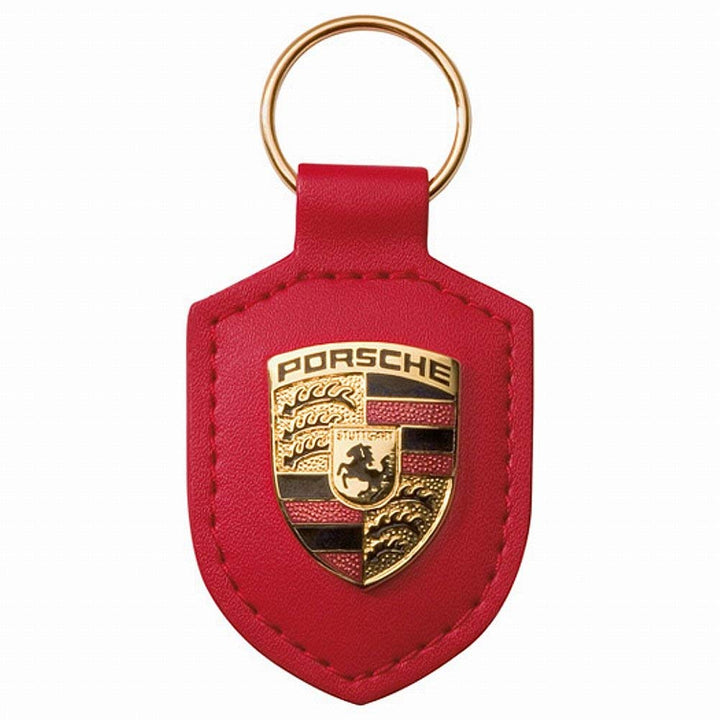 Porsche Schlüsselanhänger, rotes Leder mit Metallwappen, Lieferung in silberfarbener Porsche-Geschen