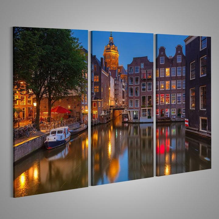 islandburner, Bild auf Leinwand Nachtansicht von Nicolaaskerk in Amsterdam Wandbild Poster Leinwandb