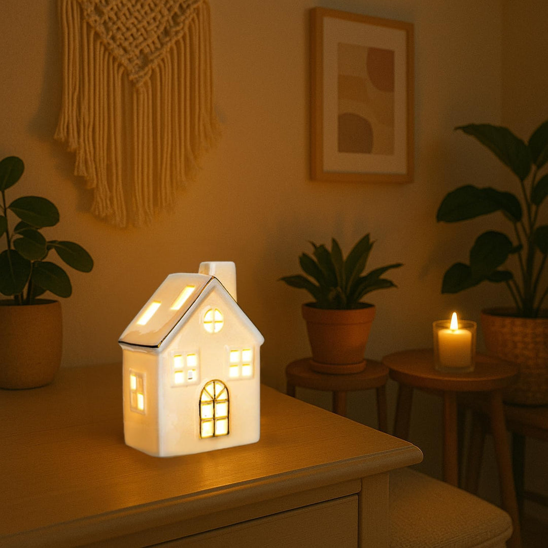 com-four® LED-Haus aus Porzellan - batteriebetriebenes Leuchthaus - weisses glänzendes Deko-Lichthäu