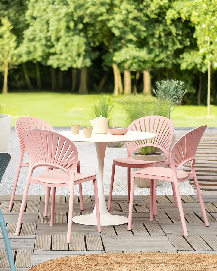 Beliani Esszimmerstühle Kunststoff rosa 4er Set für den Innen- und Aussenbereich Ostia Pastellrosa,