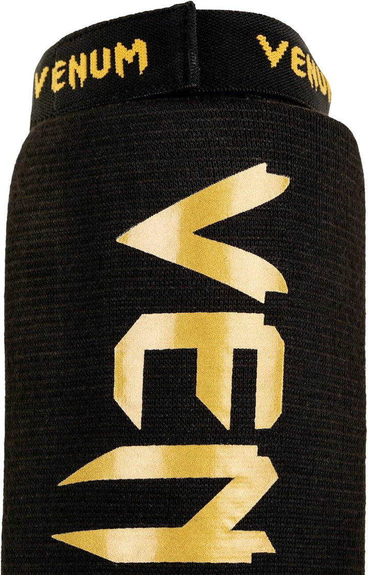 Venum Art: Uni Kontact Schienbein-und Fussschutz M schwarz / gold