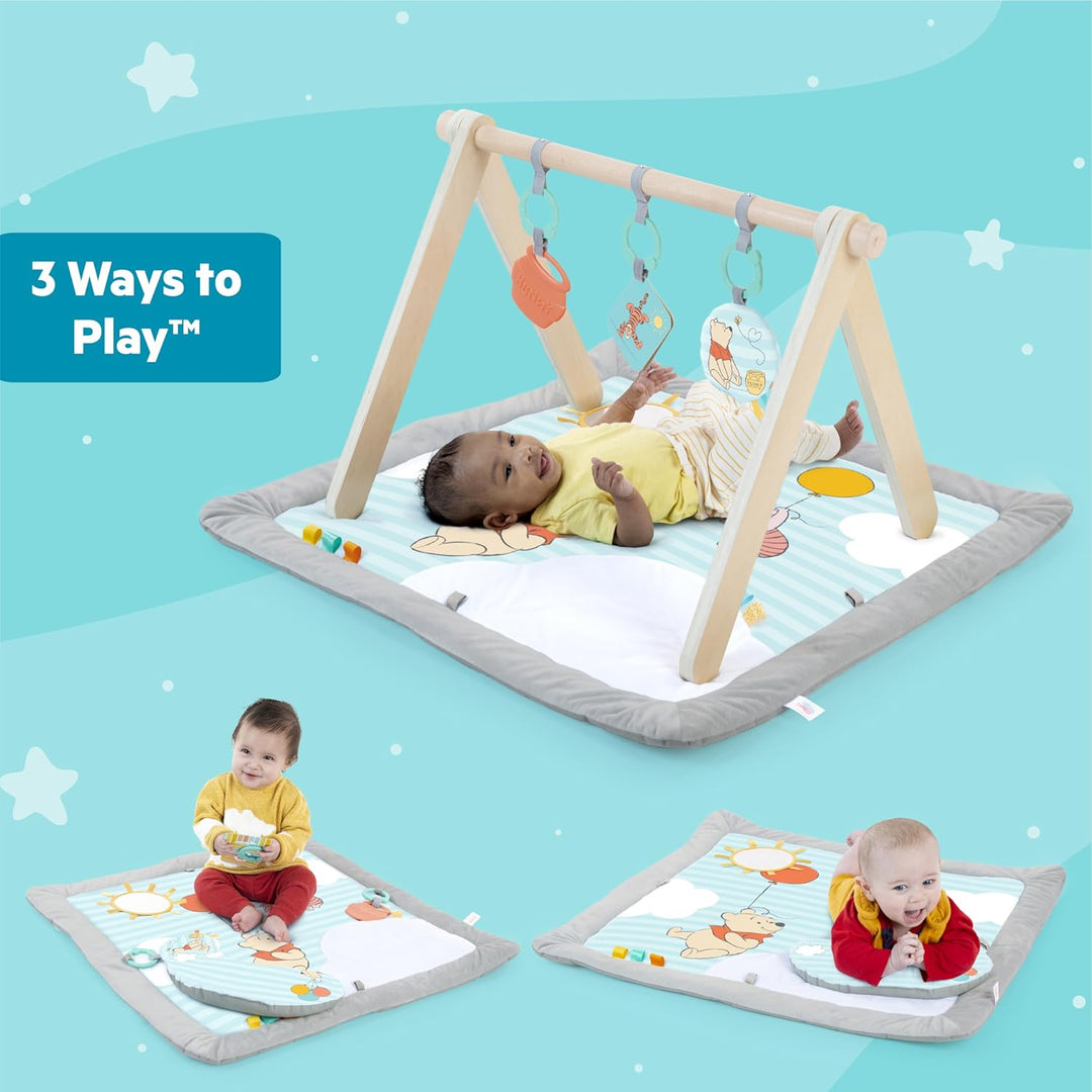 Bright Starts Disney Winnie PUUH Once Upon a Tummy Time Baby Aktivitätenmatte mit Spielzeugstange au