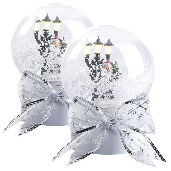 infactory Schneekugel: 2er-Set Schneekugeln mit singendem Weihnachtsmann, LED-Laterne (Schneekugel W