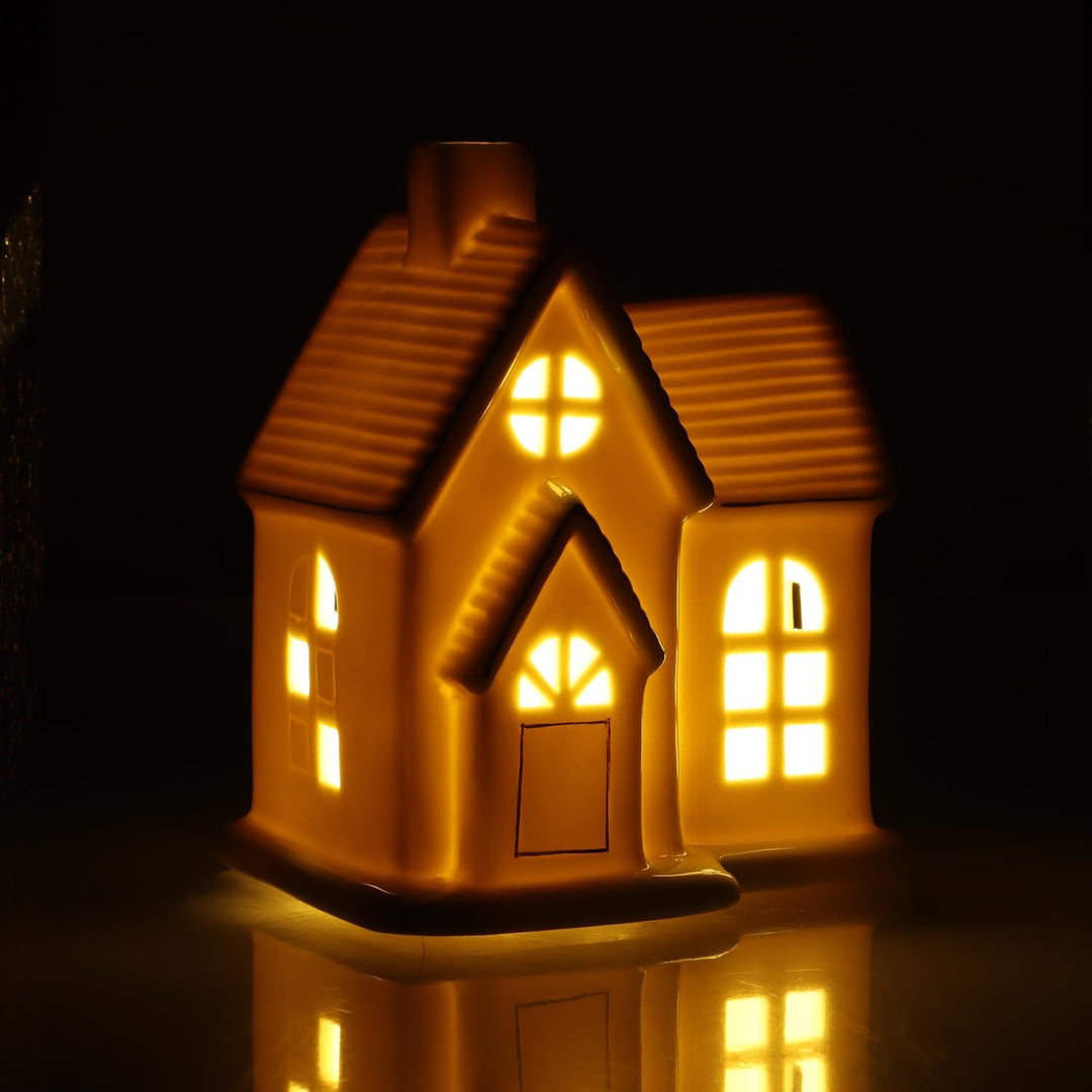 com-four® LED-Haus aus Porzellan - batteriebetriebenes Leuchthaus - weisses glänzendes Deko-Lichthäu