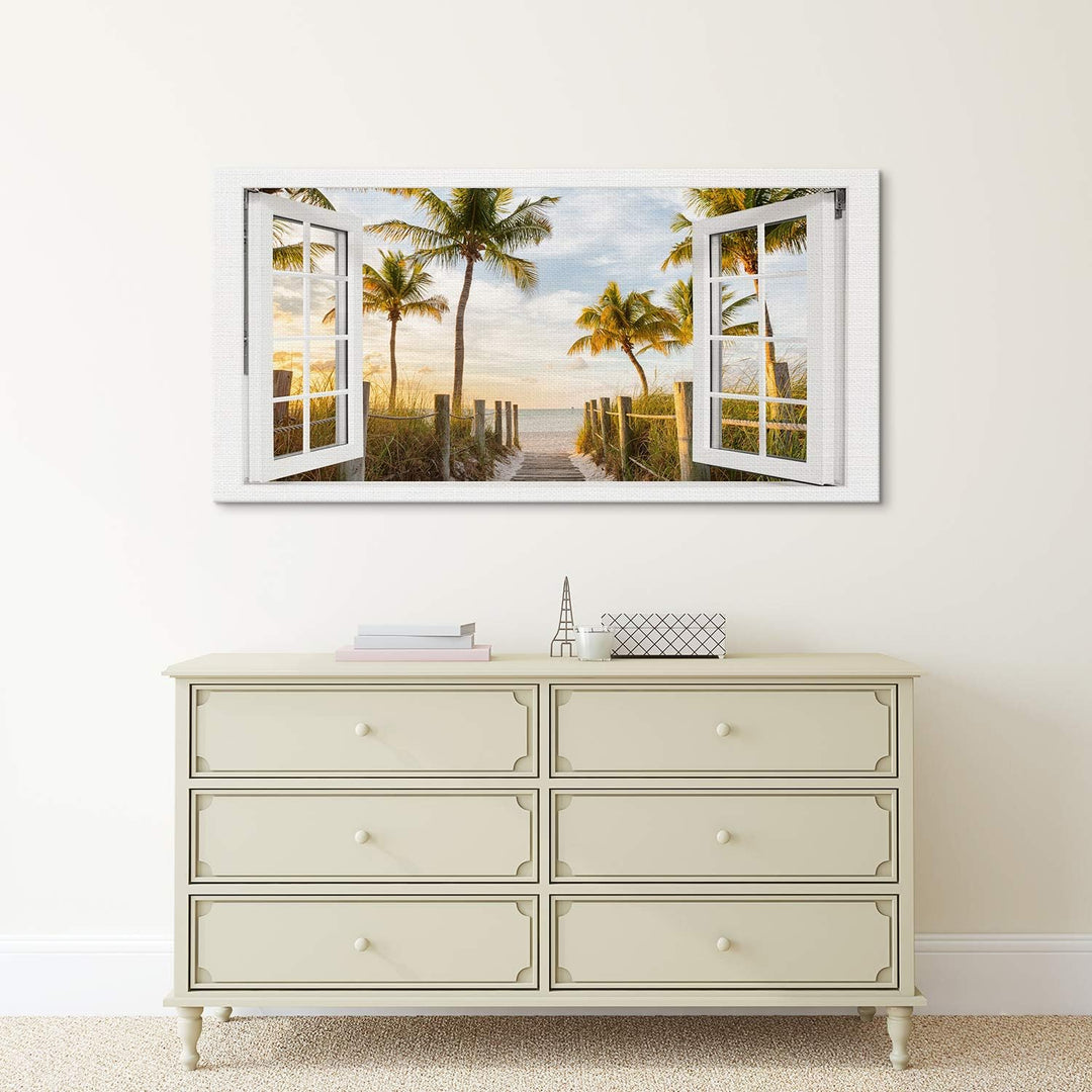 PICANOVA – Bild auf Leinwand Palmenweg zum Meer Fenster 100x50cm – Leinwandbild – Premium Leinwanddr
