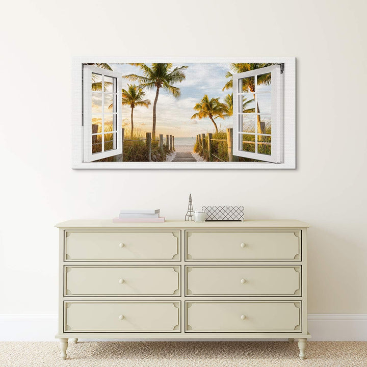 PICANOVA – Bild auf Leinwand Palmenweg zum Meer Fenster 100x50cm – Leinwandbild – Premium Leinwanddr