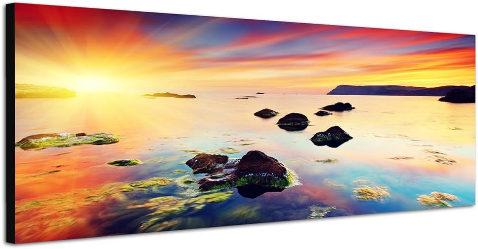 Paul Sinus Art Panoramabild auf Leinwand und Keilrahmen 150x50cm Meer Steine Abendhimmel Sonnenunter
