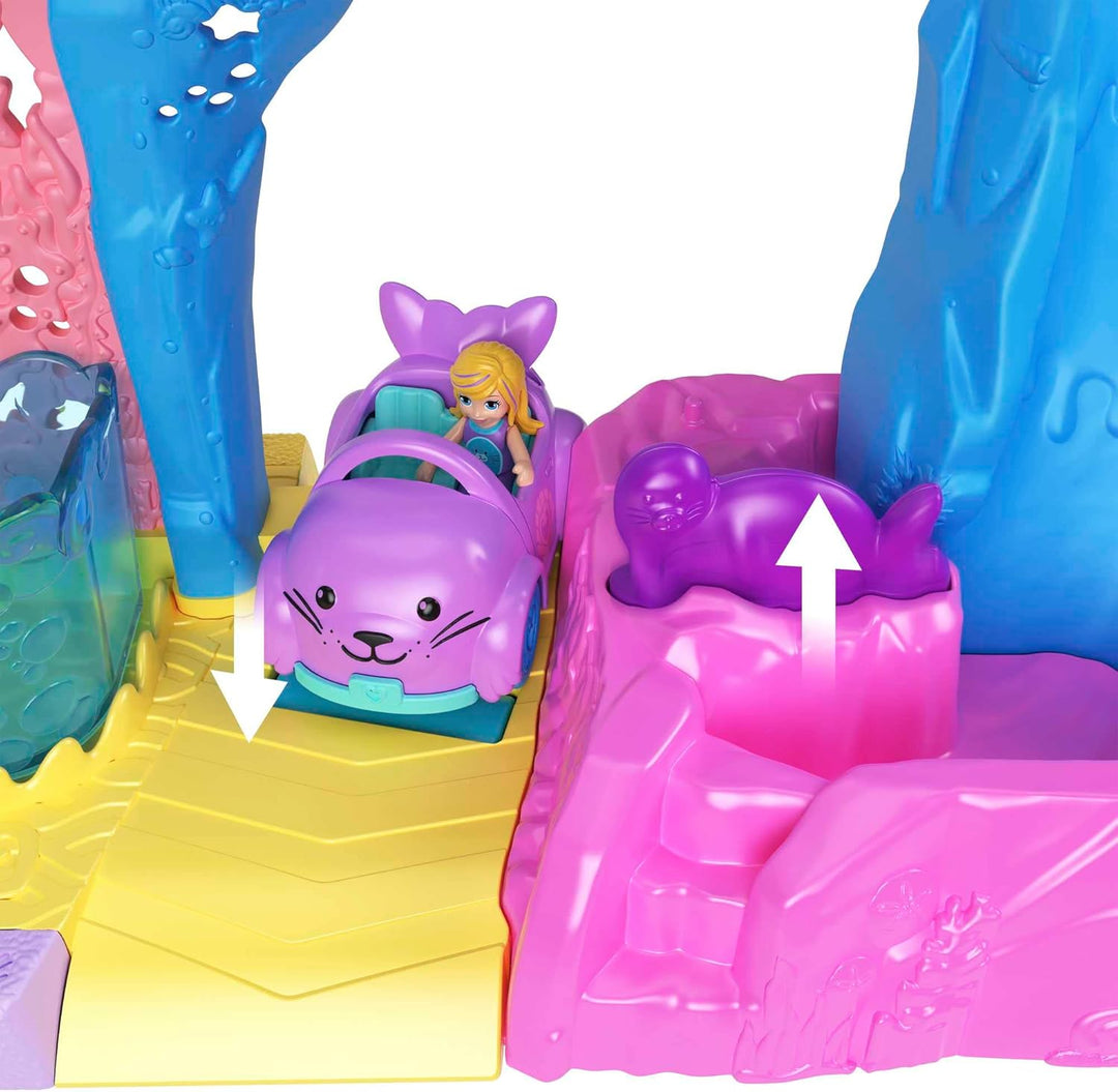 Polly Pocket Pollyville Aquarium mit Shani, Spielset mit 2 Puppen, Spielzeugauto und 11 Zubehörteile